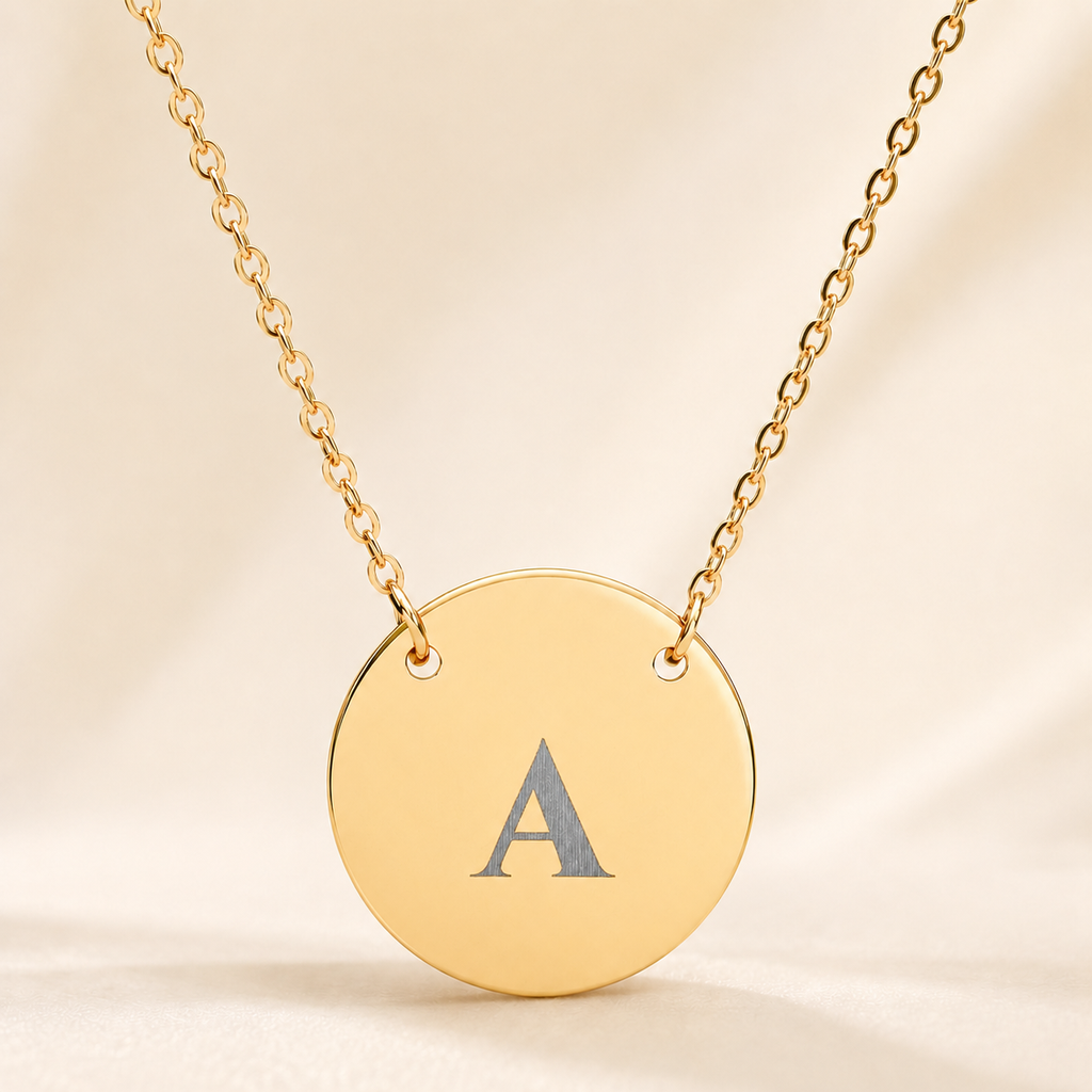 Personalized single initial necklace with custom-engraved letter A on gold circle pendant