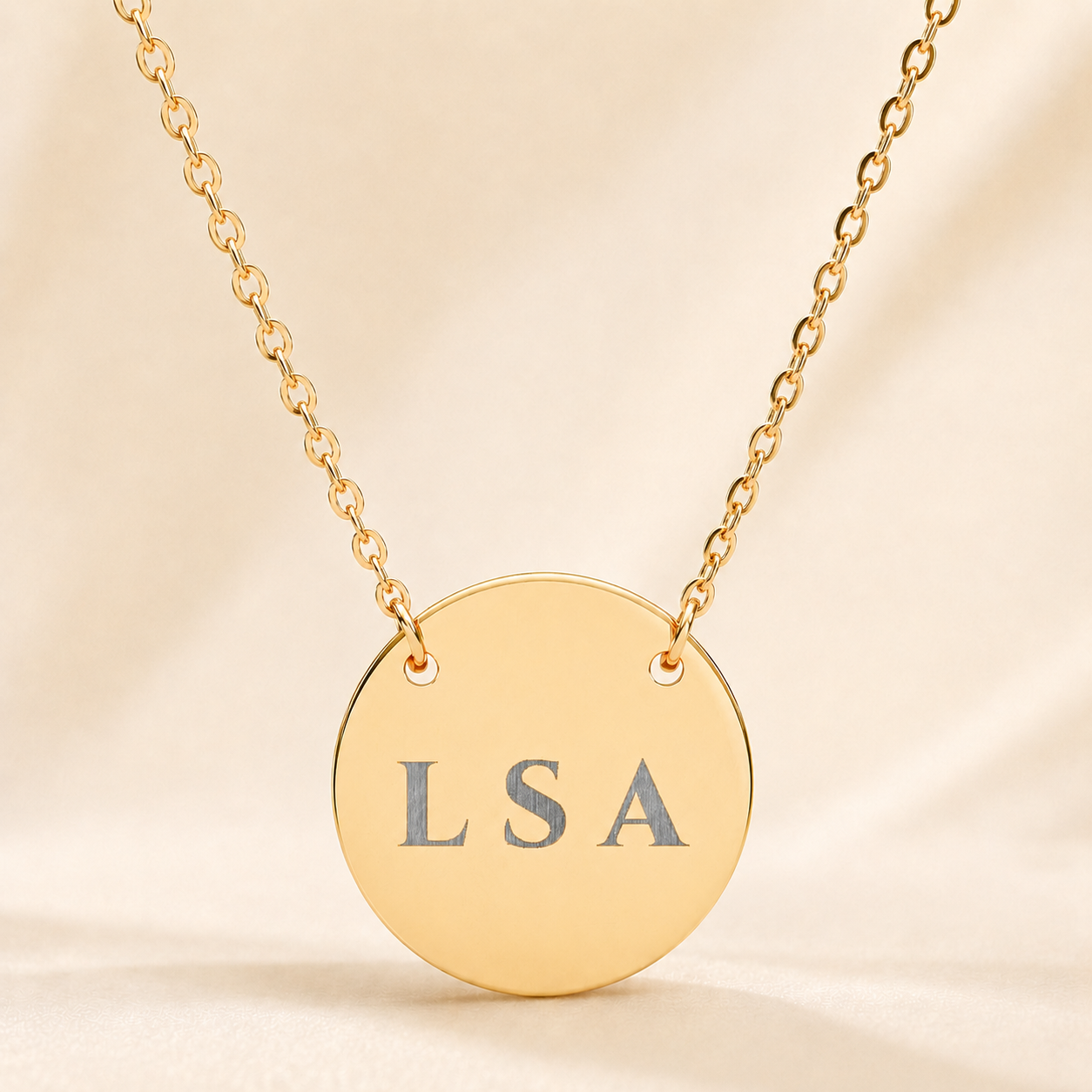 Personalized three-initial necklace with custom engraved letters LSA on gold circle pendant