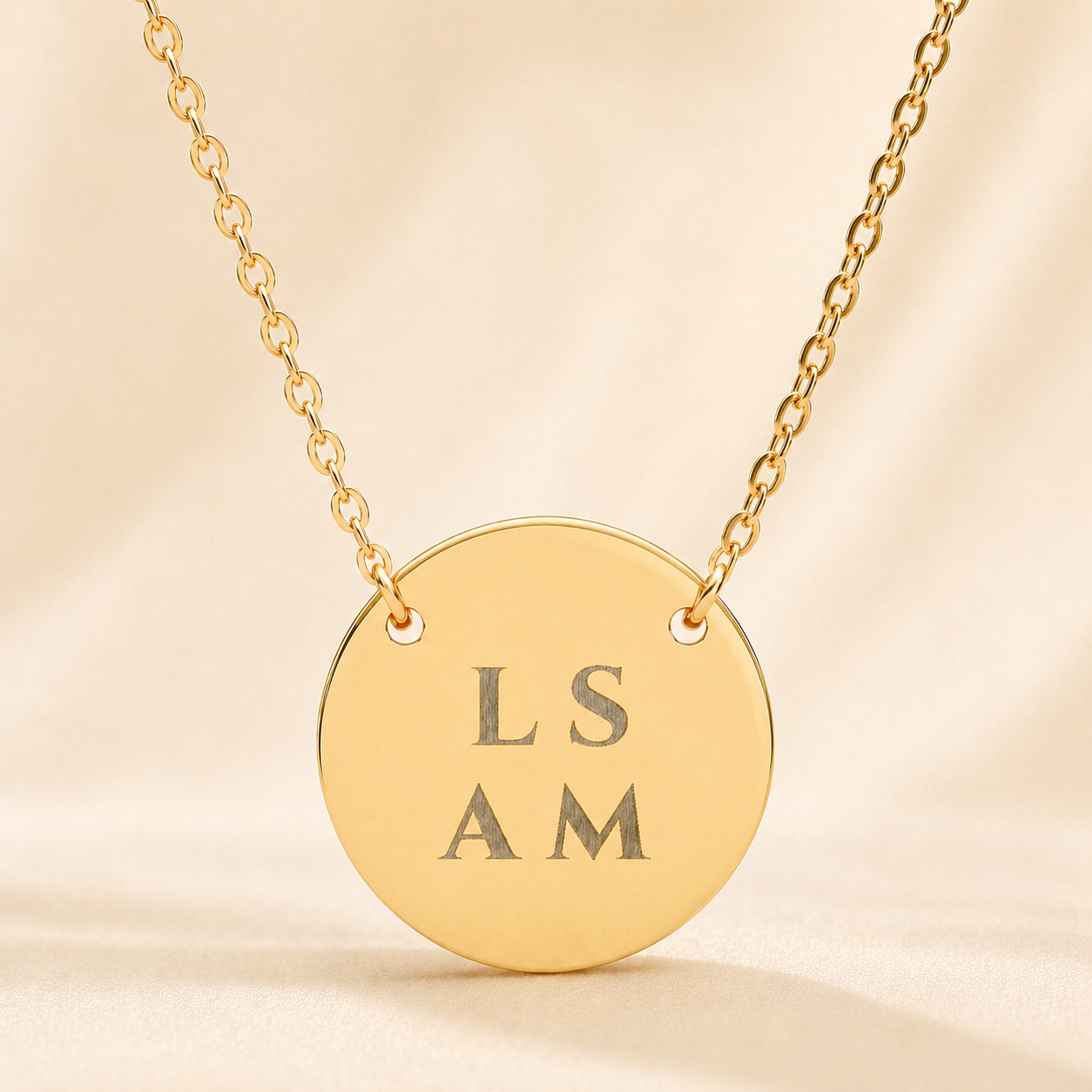 Personalized name necklace with custom engraved text 'LS AM' on gold circle pendant with spacing