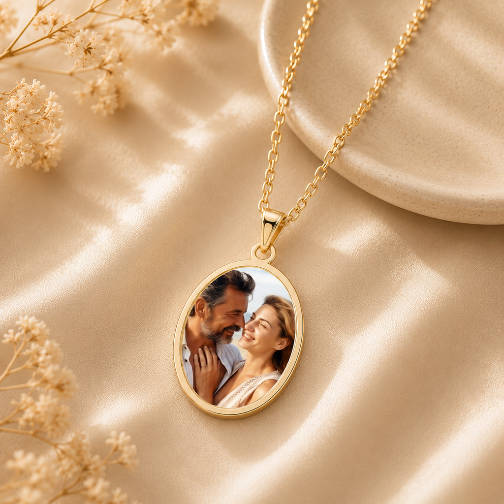 Close-up of personalized oval photo pendant with couple portrait