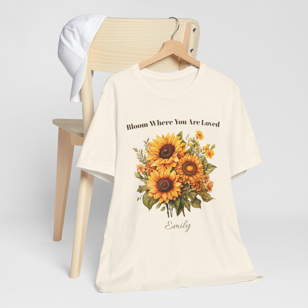 Bloom Where You Are Loved personalized t-shirt flat-lay with greenery