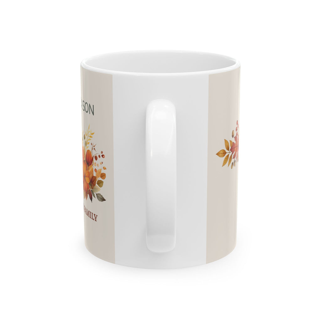 Cozy Season personalized mug displayed on a table with fall leaves