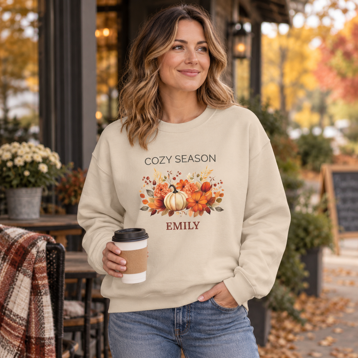 Personalized name customization preview on the Cozy Season pumpkin sweatshirt