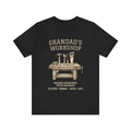 Personalized Grandad's Workshop black t-shirt with a vintage workbench-and-tools design and custom grandkids' names