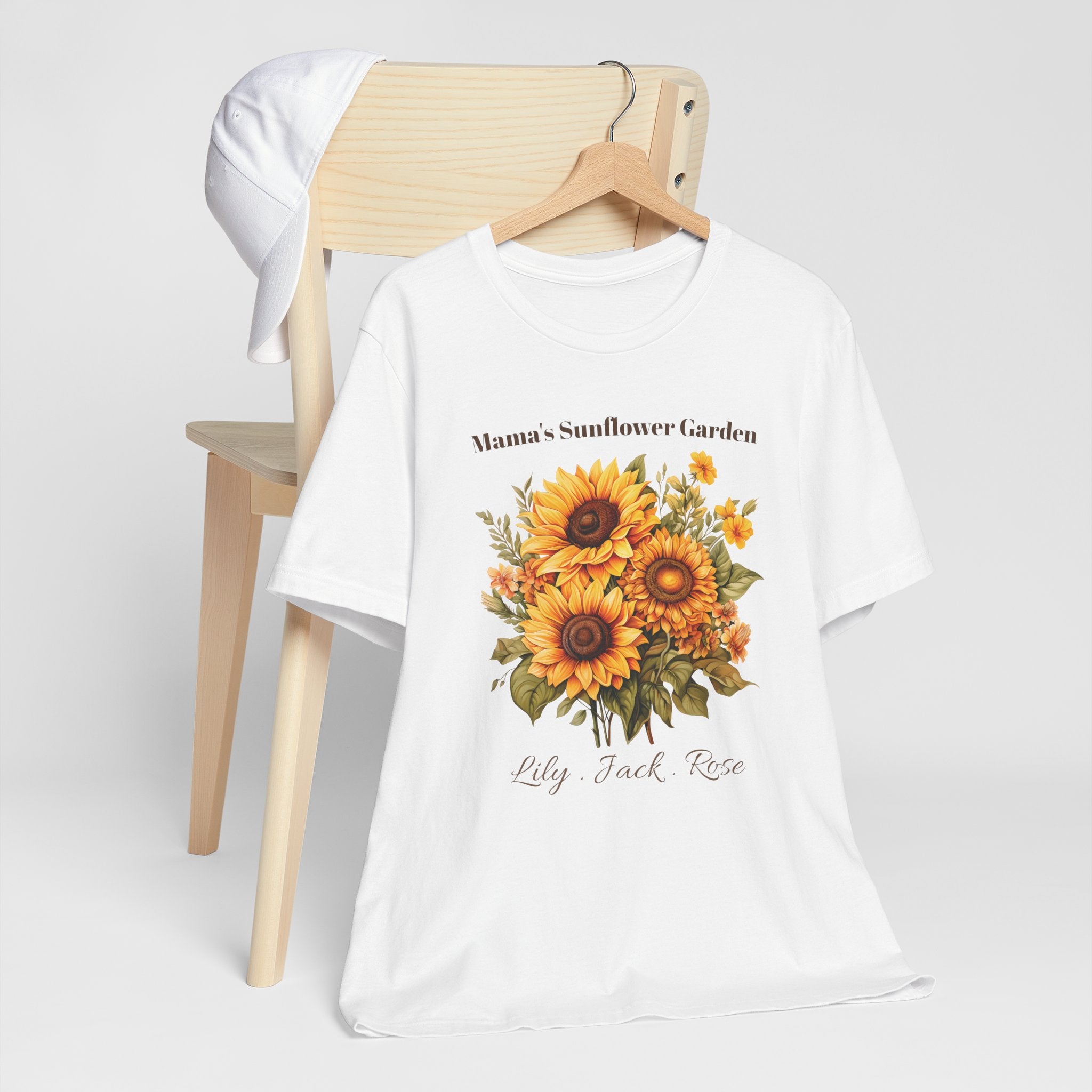 Mama's Sunflower Garden personalized t-shirt flat-lay with greenery