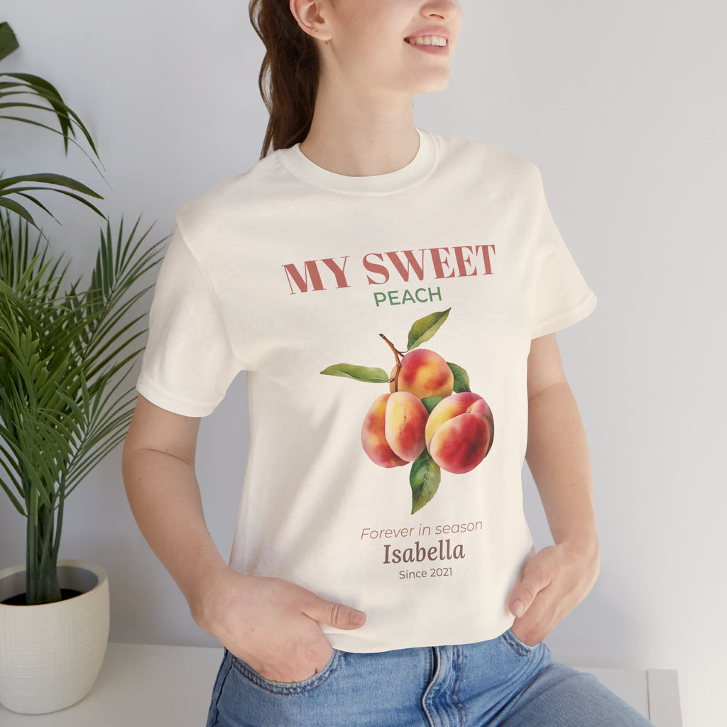 My Sweet Peach personalized t-shirt flat-lay with greenery