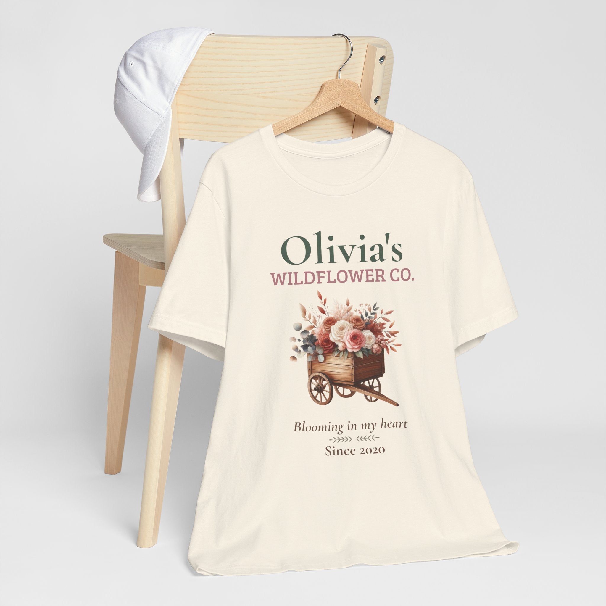 Wildflower Co. personalized t-shirt flat-lay with greenery