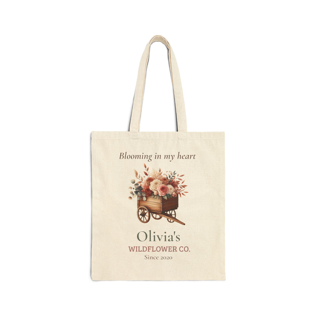 Personalized Wildflower Co. natural canvas tote reading 'Blooming in my heart' with a floral cart, custom name and year